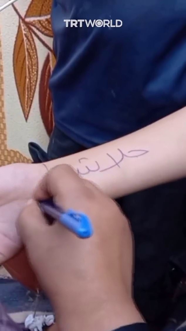 A video widely circulated on social media shows older children writing their friends' names in Arabic script with felt-tip pen
