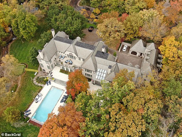 It features a Beverly Hills-style pool, visible from the air, with a hot tub