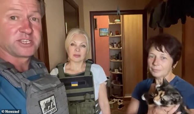 Nowzad founder Pen Farthing with Natalia (pictured center), who runs an animal shelter in Kramatorsk in eastern Ukraine, with a cat owner who refuses to leave her home.