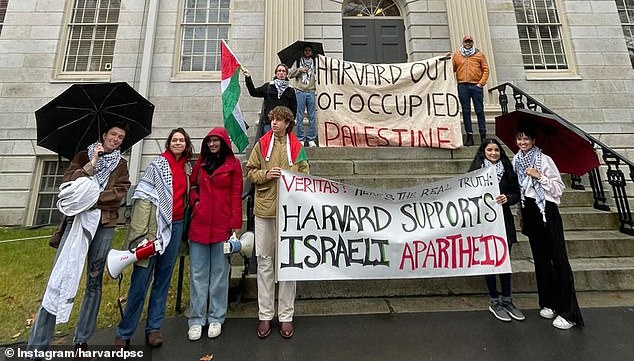 The Palestinian Solidarity Committee holds banners outside the prestigious college