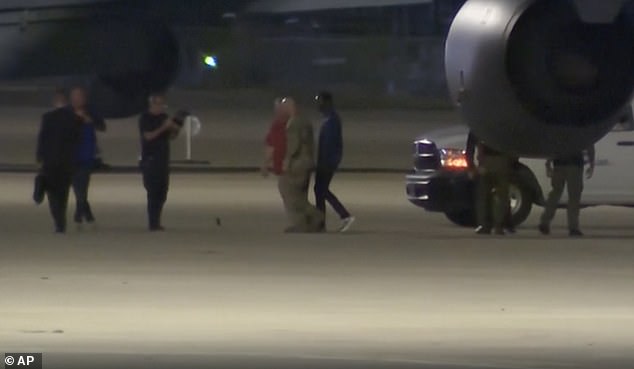 King appears calm, wearing casual clothes and is photographed arriving in America after being expelled from North Korea