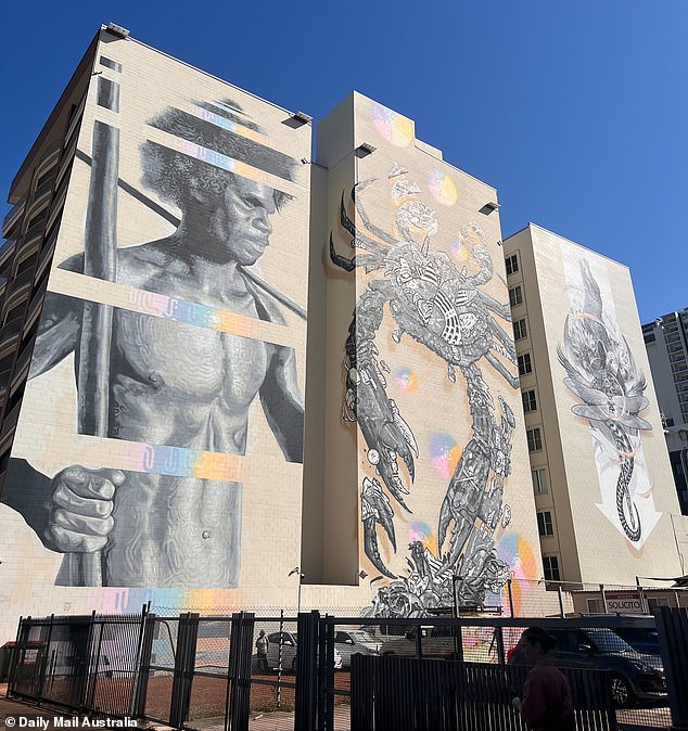 A breathtaking trio of gray tones painted last year adorns the side of an apartment building.  David was stunned to see artist Andrew Bourke create the towering designs freehand