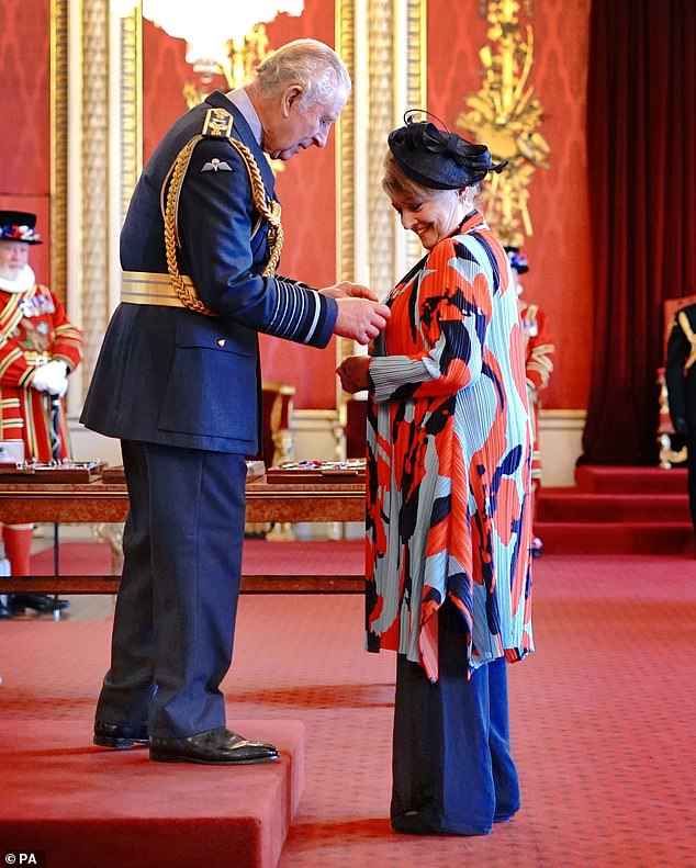 Honoured: The 69-year-old GB News presenter received the honor from King Charles at Buckingham Palace on Wednesday and posed proudly for photos