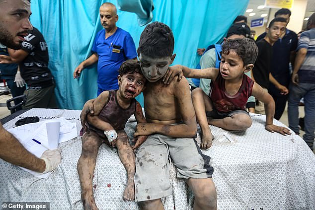 Injured Palestinian children in a hospital in Gaza on October 24 after an Israeli airstrike