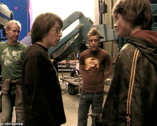 Accident: David Holmes was rehearsing a flying scene with an explosion when he crashed to the ground while working on Harry Potter and the Deathly Hallows: Part 1 (Daniel, right, next to stunt double David (second from left) in 2009)