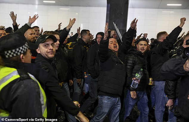 Borussia Dortmund fans were marched to the stadium surrounded by a large police presence (no indication that any of the supporters pictured were involved in clashes)