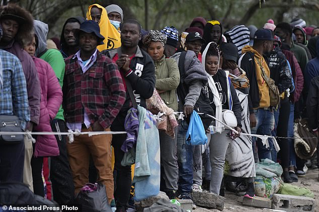 Haitian migrants hoping to seek asylum in the US wait to register their names on a list created by a religious organization in Reynosa, Mexico, December 21, 2022