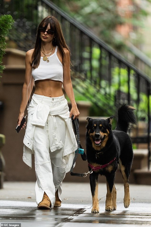 Nadia shared a photo to her stories of supermodel Emily Ratajkowski (pictured) wearing her jeans.  The American supermodel, 32, is pictured walking her dog while wearing the white Nico Cargo Jean from Nadia's Henne line.  Pictured in August