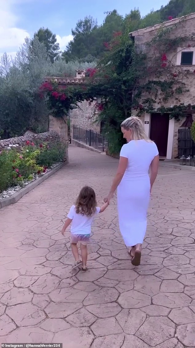 The footage showed Hannah strolling around a luxury villa with her daughter Ava, three, saying psychics bought her the 'joy of certainty' when making life decisions