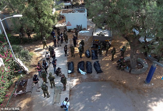 An aerial photo shows the bodies of victims of the Hamas attack on the Kfar Aza kibbutz