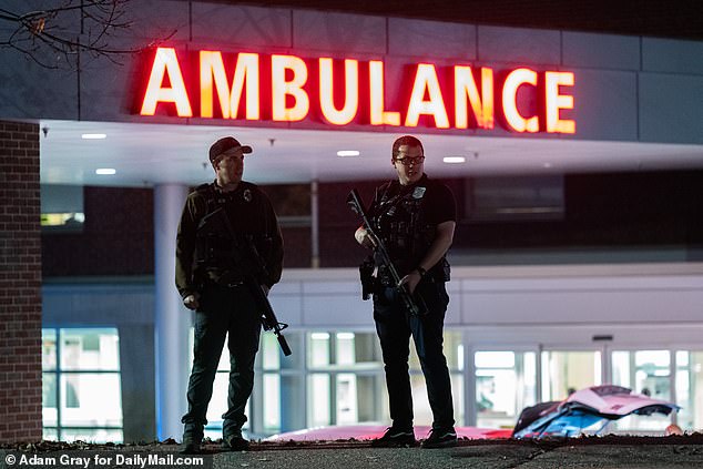 The shooting is the deadliest in the United States this year.  Pictured: Law enforcement officers stand guard outside Central Maine Medical Center