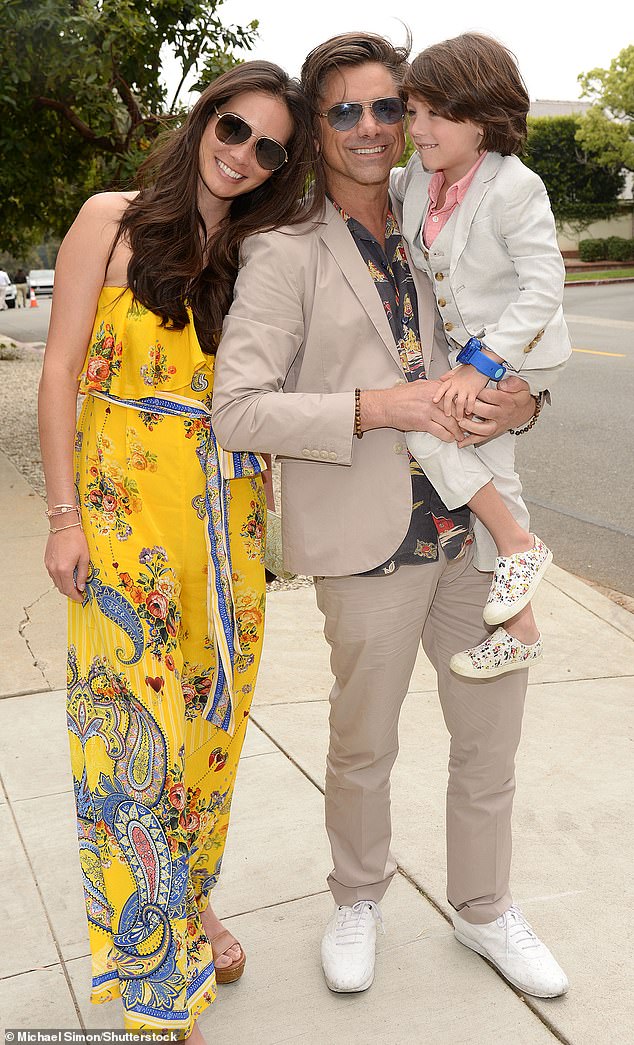 The actor pictured in May 2023 with his wife Caitlin McHugh and their five-year-old son Billy, who he credits with helping him stay sober