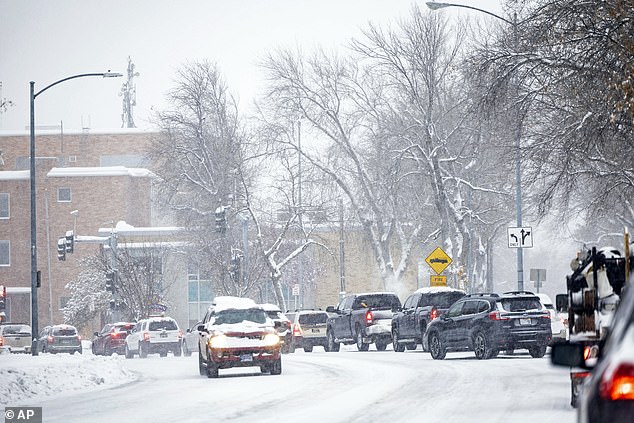 Snow-covered roads in Montana.  The National Weather Service said heavy snowfall up to an inch per hour and snow-covered, icy roads will make for difficult travel conditions.