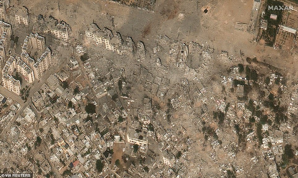 This neighborhood has been transformed into a dusty wasteland with crumbling buildings and rubble strewn everywhere after the Israeli bombings