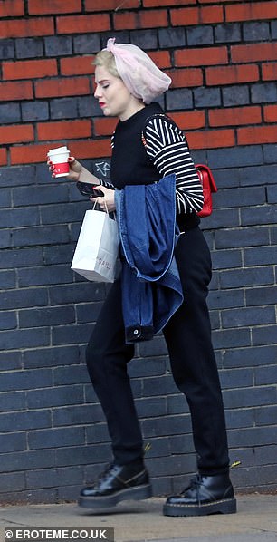 Relaxed: The actress, 29, wrapped her platinum blonde locks in a hairnet as she stopped by Gail for a cup of coffee