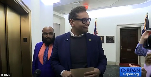 Rep. George Santos, who is facing charges of misusing campaign funds, wore an assault rifle lapel pin on Capitol Hill in February