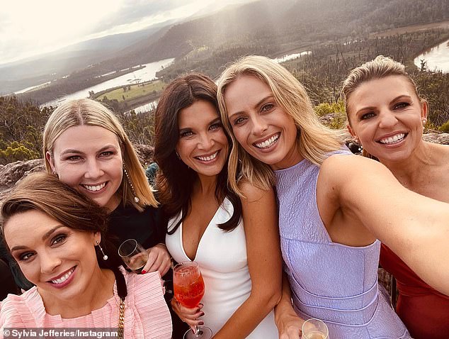 Amelia (centre) and co-star Lizzie Pearl (right), as well as Sky News reporter Laura Jayes (left) and Sylvia posed at the wedding.  All depicted