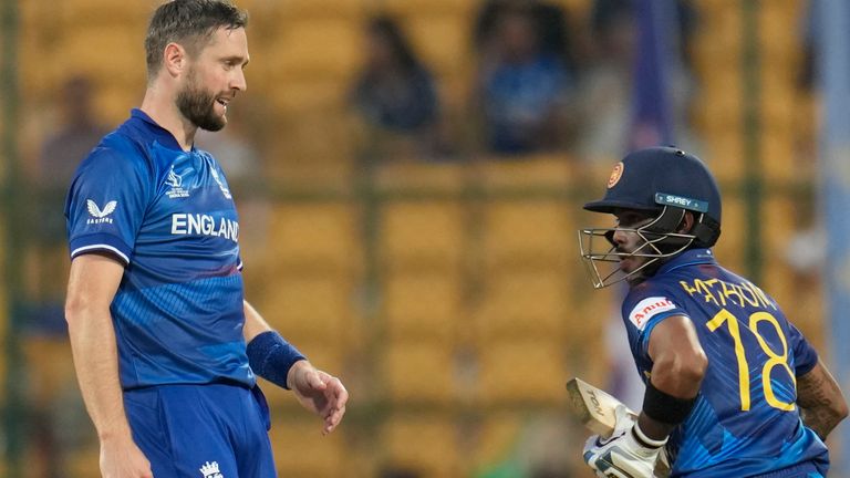 England's Chris Woakes reacts after Sri Lanka's Pathum Nissanka hit a four during his delivery during the ICC Men's Cricket World Cup match between England and Sri Lanka in Bengaluru, India, Thursday, October 26, 2023. (AP Photo/Aijaz Rahi)