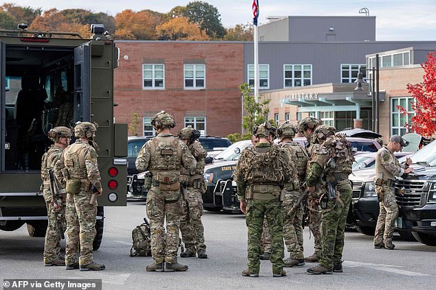 Law enforcement officers gather outside Lewiston High School on Thursday