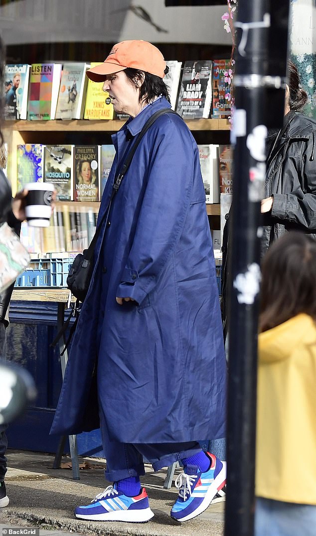 Relaxed look: The Texas singer, 55, kept it casual in an oversized blue trench coat, which she wore over color-matched jeans and a light blue collared shirt