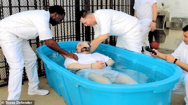 In a bizarre twist, Gary Dickerson's sister joins religious leaders in asking for Speer's life to be spared.  Sammie Martin said Speer is 'repentant' and deserves freedom (Photo: Speer's baptism behind bars)