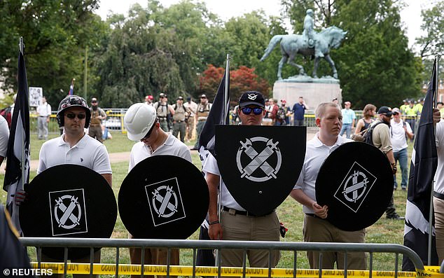 White supremacists gather under the statue of Robert E. Lee during the Unite The Right rally