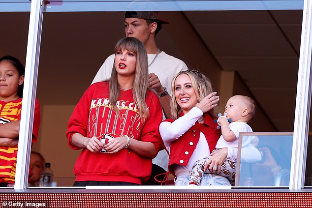 Must-watch: Not only does she hook up with Kansas City in what has become a sensational romance, but her appearances at his football games have become must-watch television for Swifties;  seen on October 22 with Brittany Mahomes