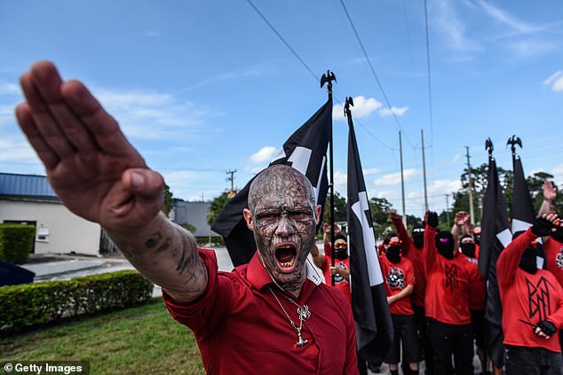 A man gives a Nazi salute as two neo-Nazi groups, Blood Tribe and Goyim Defense League, held a rally in Orlando, Florida in September 2023