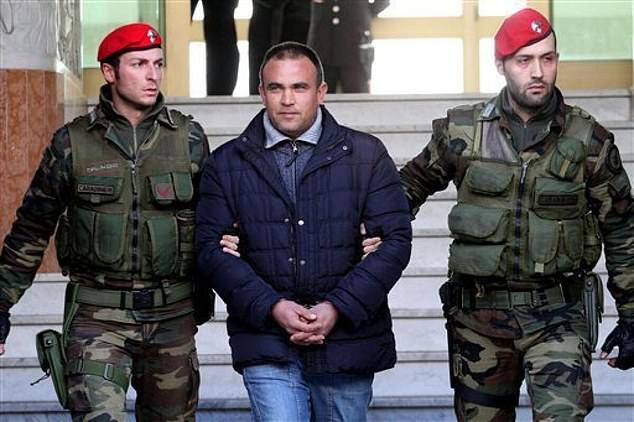 Francesco Maisano, alleged mafia boss of the 'Ndrangheta crime syndicate, flanked by paramilitary police shortly after his arrest in Calabria, southern Italy in March 2011