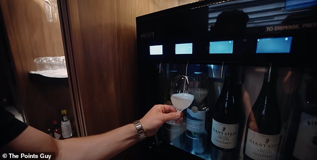 Nicky uses the self-service bar in Singapore Airlines' Silver Kris lounge