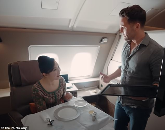 Nicky enjoyed a luxurious meal served by Singapore Airlines' lead flight attendant, Connie.  Then I got some tutoring on how to serve customers