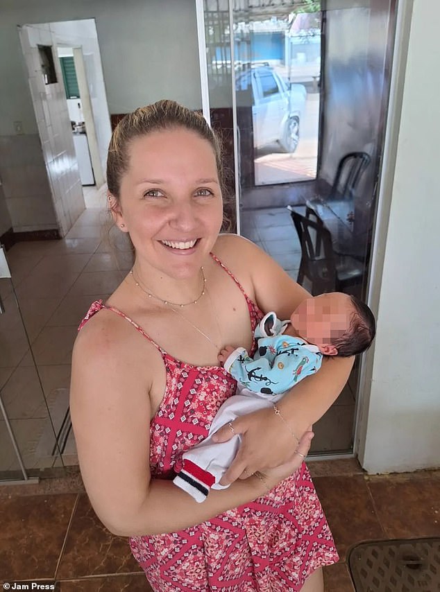 Uber driver Iara Alencar dos Santos holds the baby