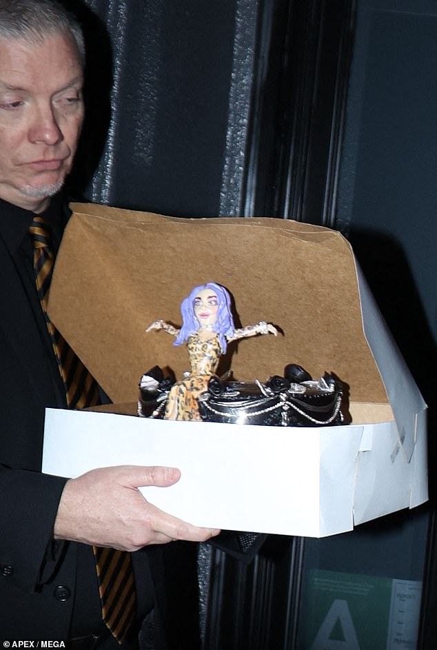 Yum: Kelly was presented with a cake decorated with a small figure of herself