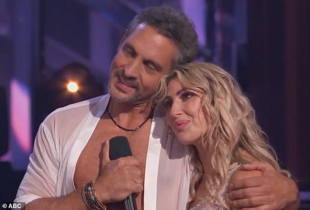 The couple put on an emotional performance during Tuesday night's live show - with Mauricio showing off his bare chest and Emma finishing the dance on top of him