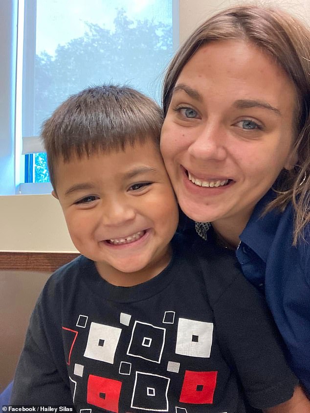 Silas, mother of a four-year-old son, was arrested and taken into custody on October 15 after repeatedly calling police and begging for help because she was 'scared' (photo: Silas with her four-year-old son)