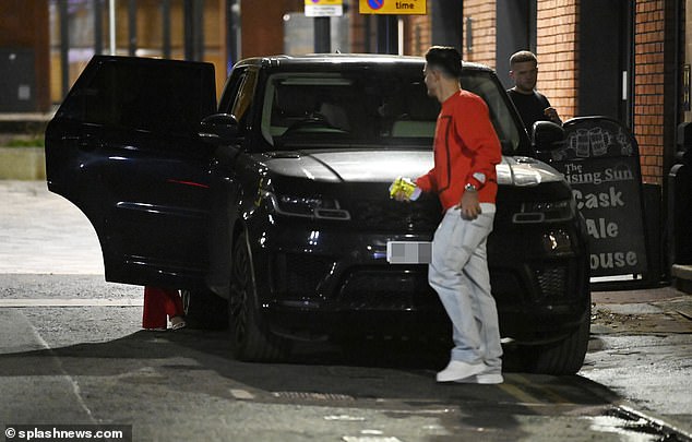 Yellow card: The 28-year-old footballer, who signed a £100million deal for Pep Guardiola's side in 2021, was fined after parking his luxury Range Rover on double yellow lines