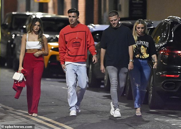 Night out: They were joined by their friends on the double date
