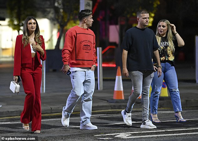Double date: Sasha and Jack (left) both wore red for the double date with their friends