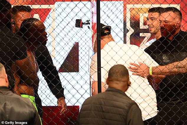 John Fury headbutts a glass panel during the final press conference before the fight between his son Tommy and KSI on October 12