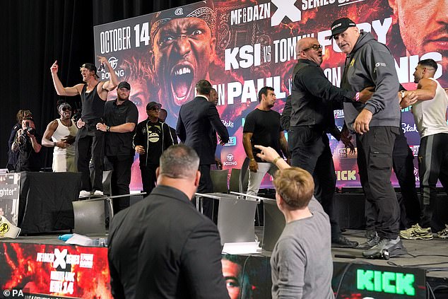 John was seen flipping tables and shouting at KSI (far left in the white vest) after the YouTube boxer threw shade at the name Fury