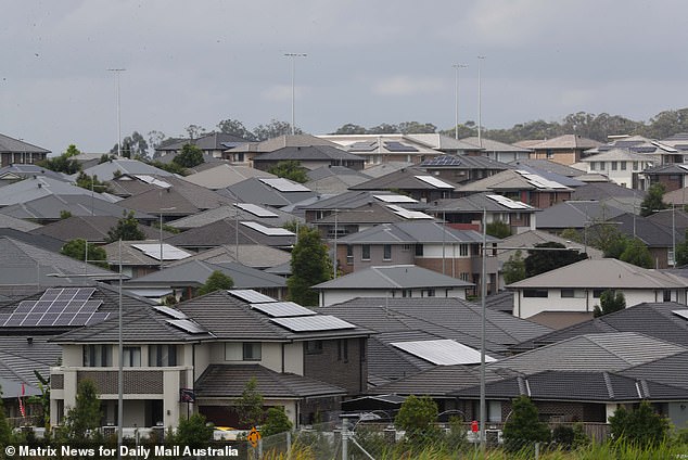 In the year to August, 413,530 permanent and long-term migrants arrived in Australia (pictured are new homes in Oran Park in Sydney's far south west)