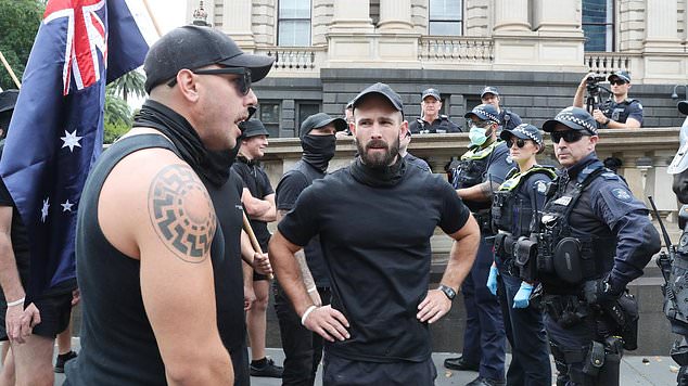 Sewell (centre) was an active face in Melbourne's neo-Nazi community and was involved in a major protest that led the state government to ban the Nazi salute