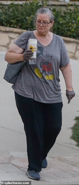 Casual: She wore a Mickey Mouse T-shirt and black pants