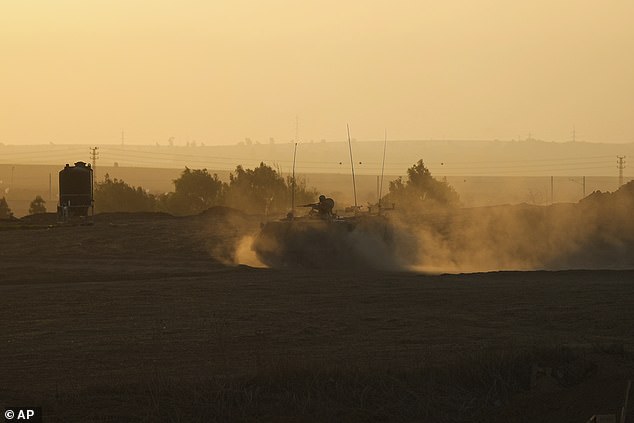 The Israeli airstrike came with an IDF warning to Palestinian civilians still living in Gaza to move south as quickly as possible.  Pictured: An Israeli armored personnel carrier approaches the border with the Gaza Strip