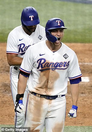 Corey Seager reacts after hitting a two-run home run to force Game 1 into extra innings