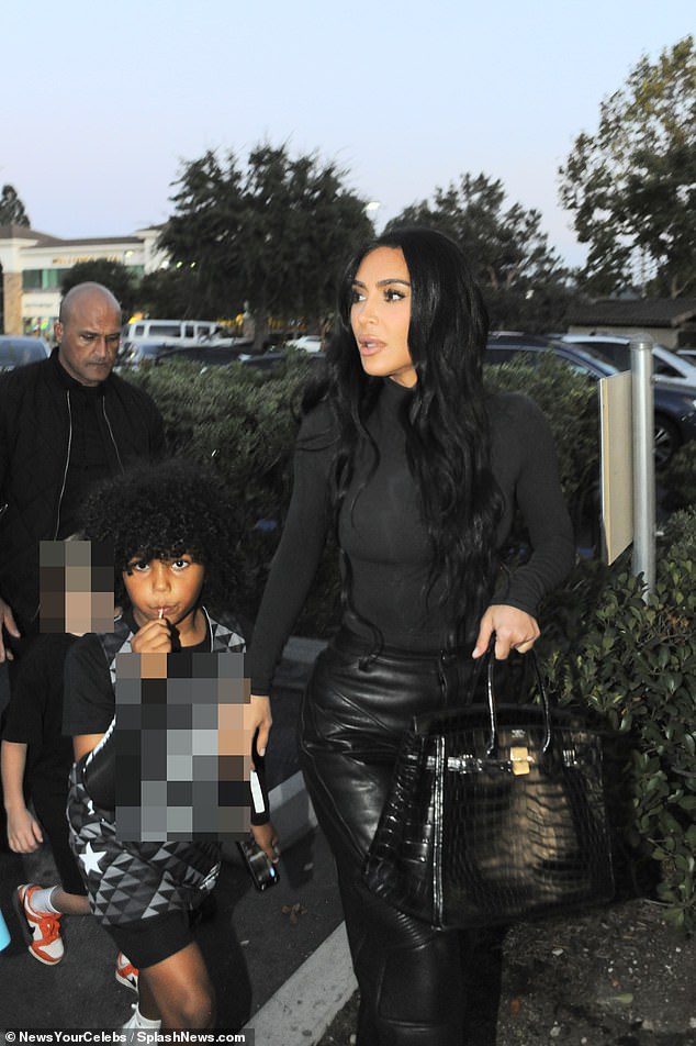 Casual yet chic, the reality TV personality looked effortlessly stylish in an all-black ensemble as she took her son and his friends for dinner in Los Angeles after their sports competition