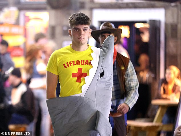 This man went out of his way to dress up as a lifeguard and get eaten by a shark