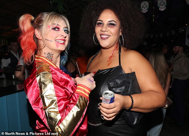 Two girls covered in blood splattered make-up enjoy their Halloween night out in Newcastle