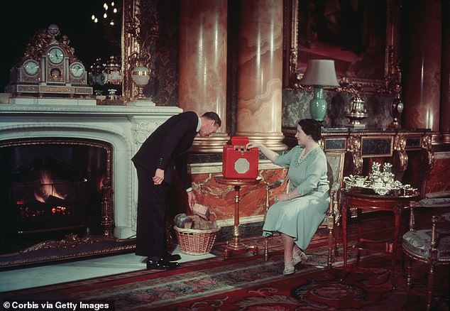 King George VI and Queen Elizabeth, the Queen Mother, at home in Buckingham Palace with a roaring fire.  Like their daughter, they preferred to heat rooms one by one...