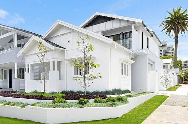 Located just 9km from the CBD and just blocks from Bronte Beach, the original home was built as a single-storey Californian bungalow.  The new design has transformed the mid-20th century original into a chic, ultra-modern resort-style home (photo, front view)